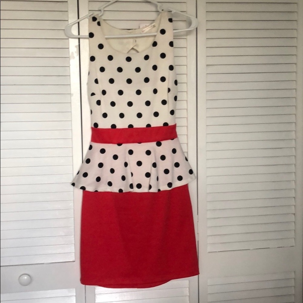 Polka dot peplum keyhole back dress